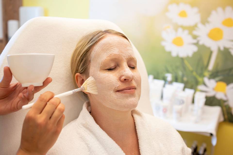 Woman Receives a Facial Mask