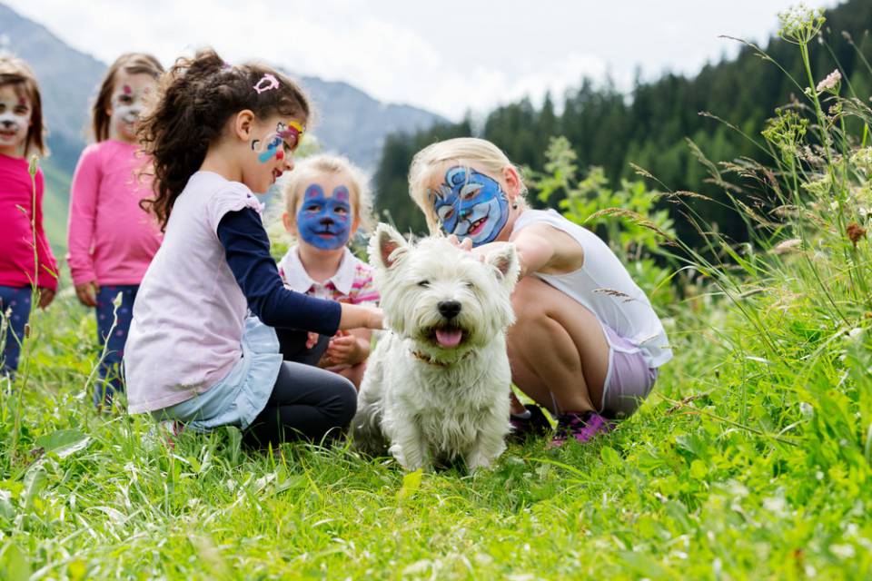 Children Standing in a Meadow