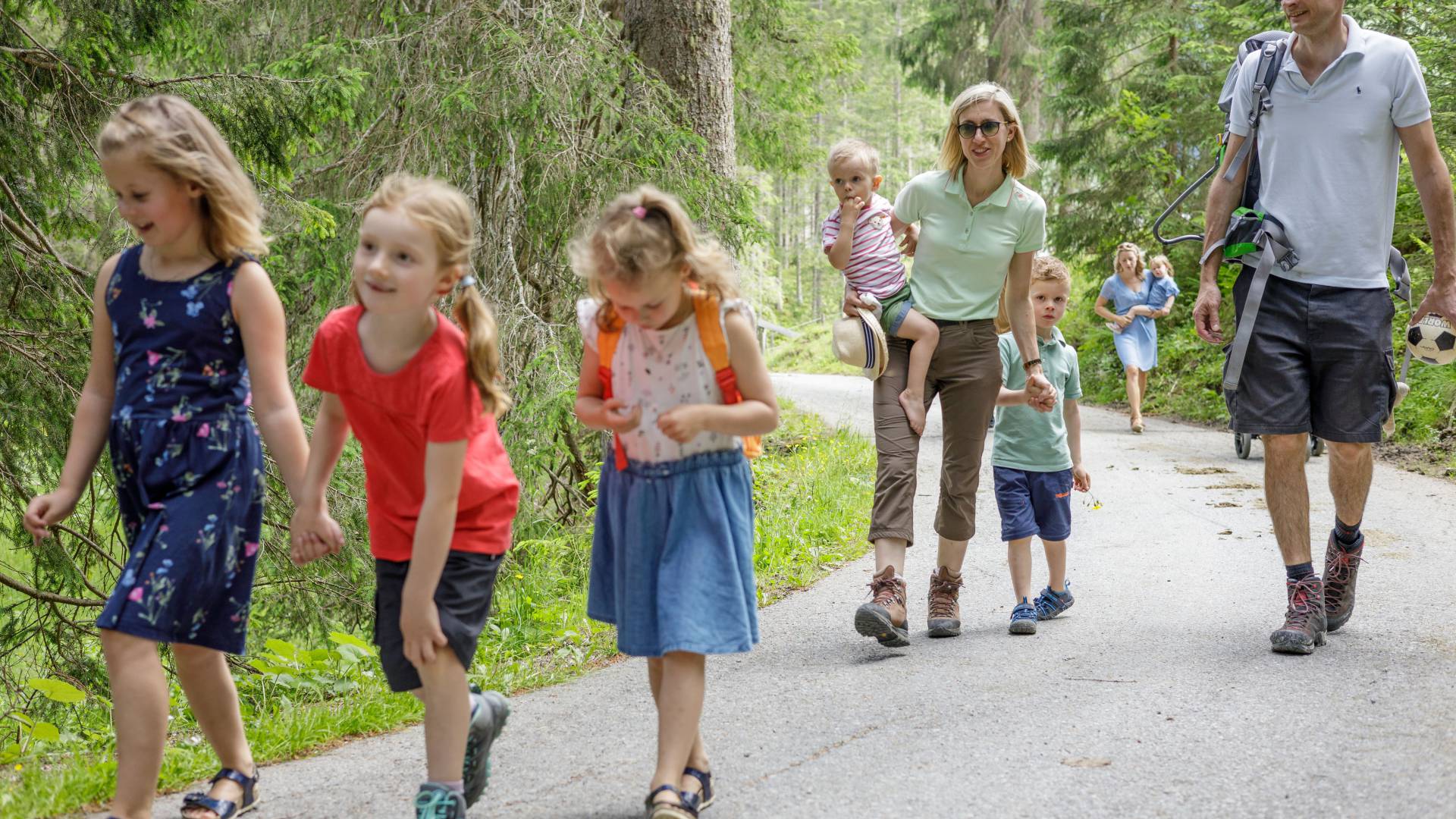 Families hiking in the forest in Tyrol
